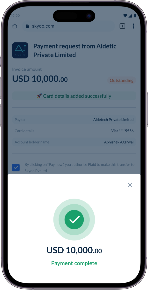 The payment-complete screen on the payer's phone: a green tick and USD 10,000.00 paid.